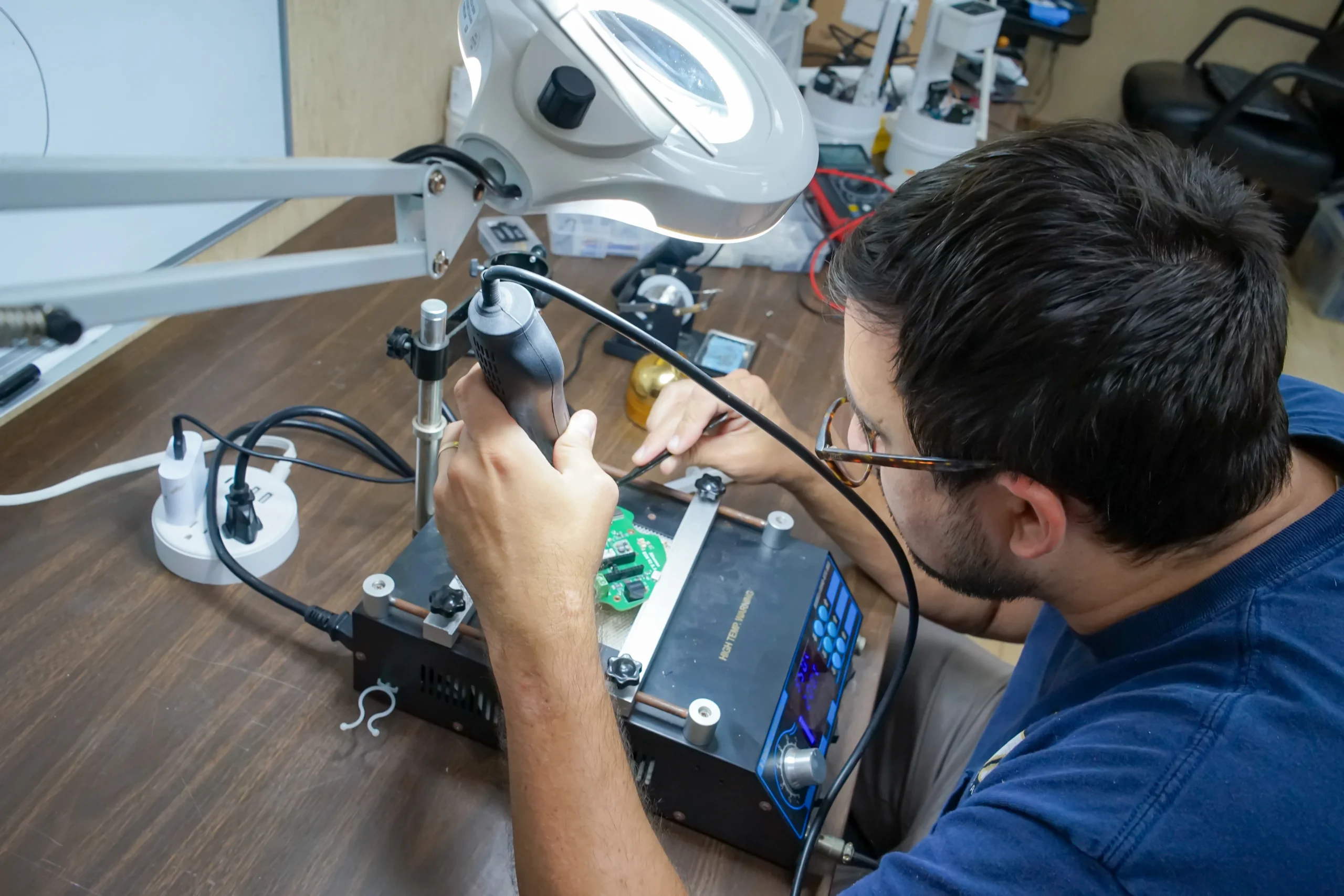 Engineer working on complex hardware development for an electronic product.